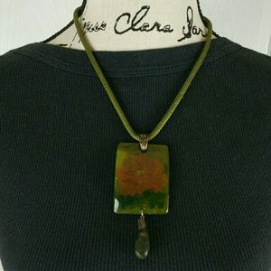 Chico's painted glass flower pendant on green cord